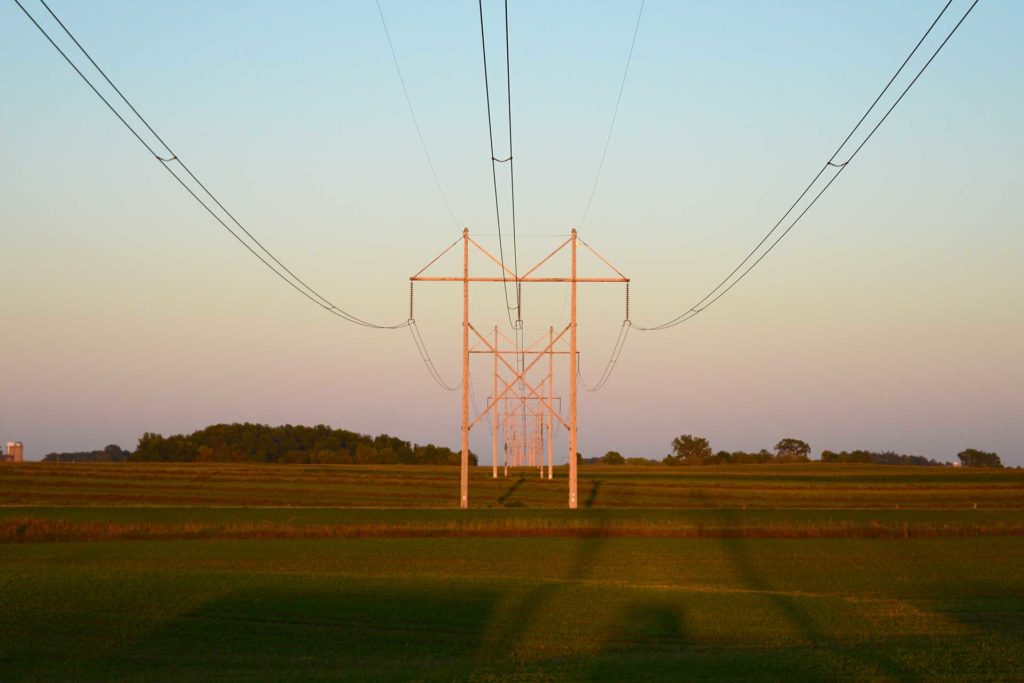 telephone poles over field