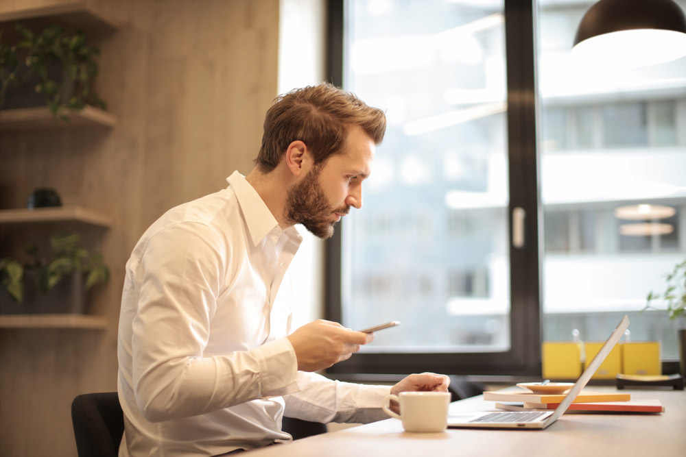 man looking at computer screen
