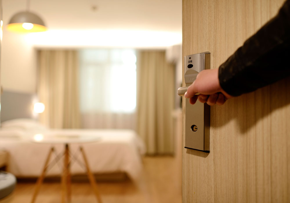 opening the door of a hotel room