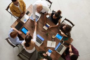 customer engagement strategists meeting at large conference table