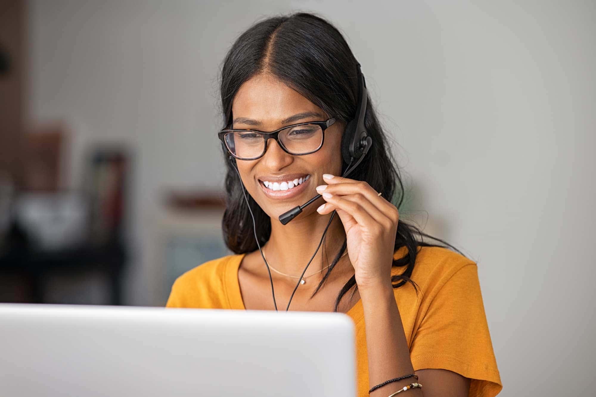 happy-indian-woman-working-in-a-call-center