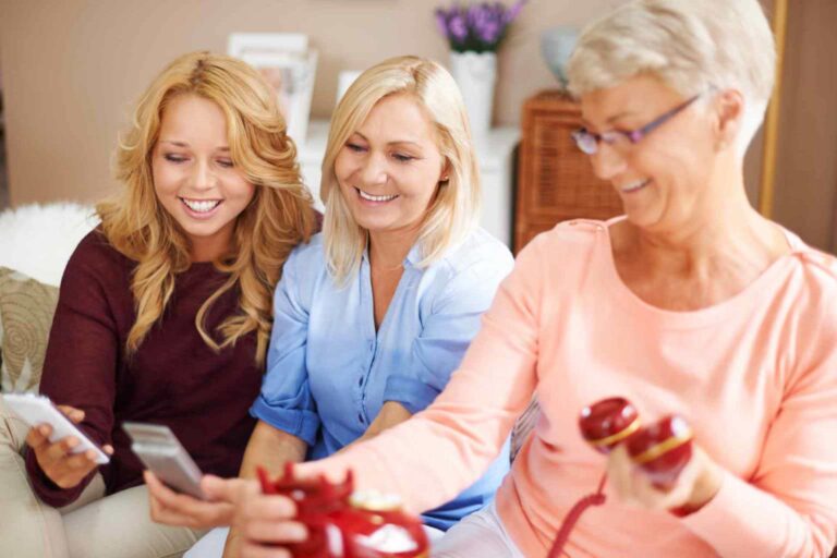 three generations of women using their phones