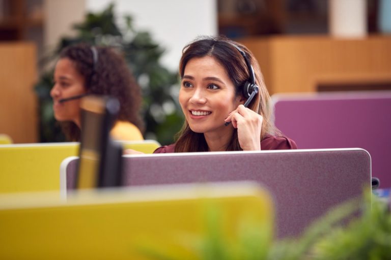 call center agent on headset practicing empathetic customer service