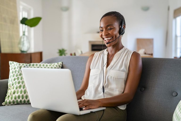 smiling woman working from home for contact center job