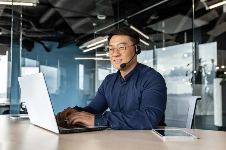 smiling contact center agent using headset