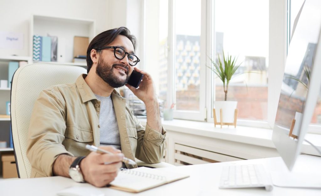 happy customer service representative talking on the phone