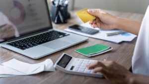 woman making online payment with a credit card
